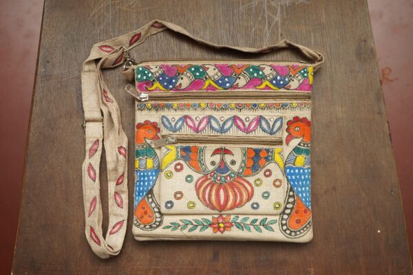 VAIDEHI HAND PAINTED SLING BAG MATERIAL:-JUTE SIZE:-9"x 9 ADJUSTABLE SLING LENGTH=35" 5 CHAIN POCKETS